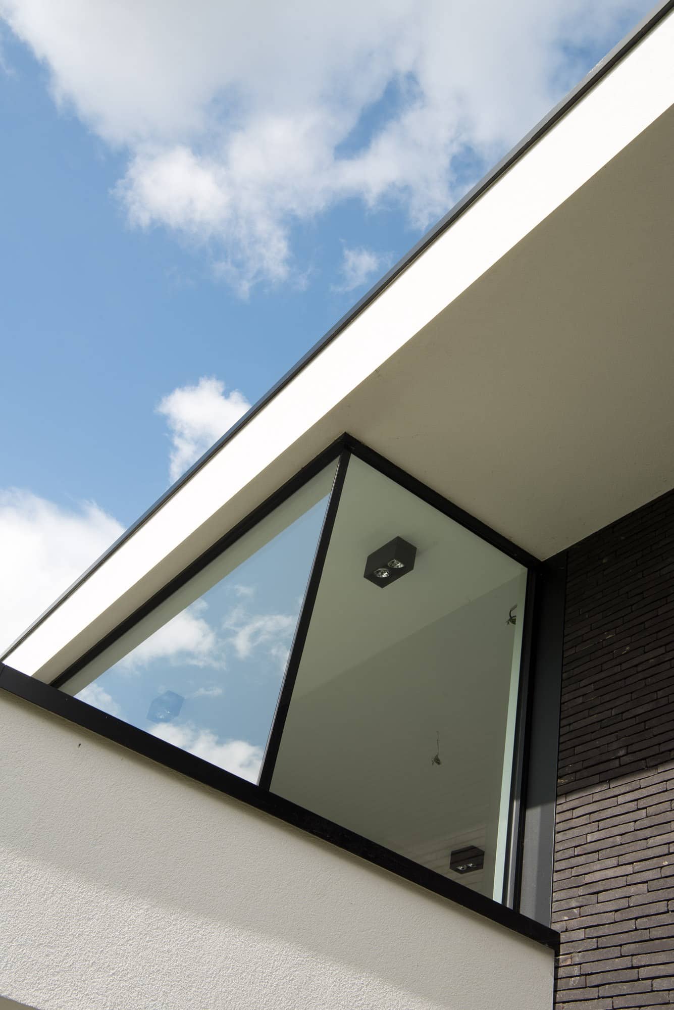 Gevelbekleding en aluminium buitenschrijnwerk ramen deuren woning Sint-Truiden Schüco Corswarem